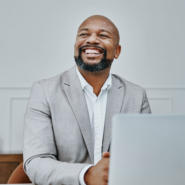 Contractor smiling with laptop