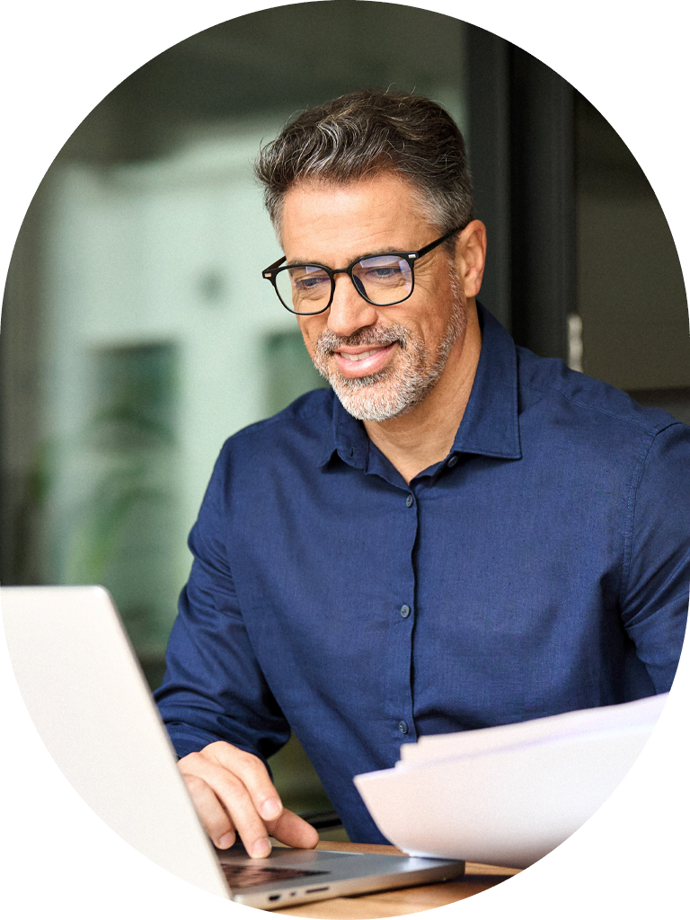 man at desk on laptop