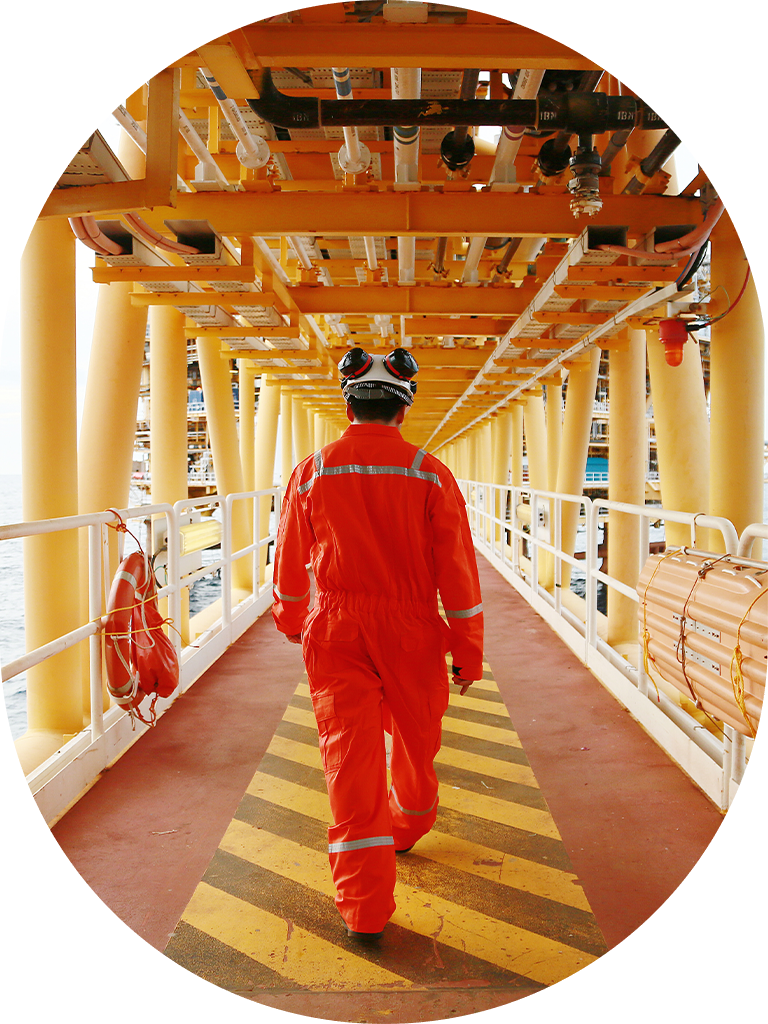 man walking on oil rig